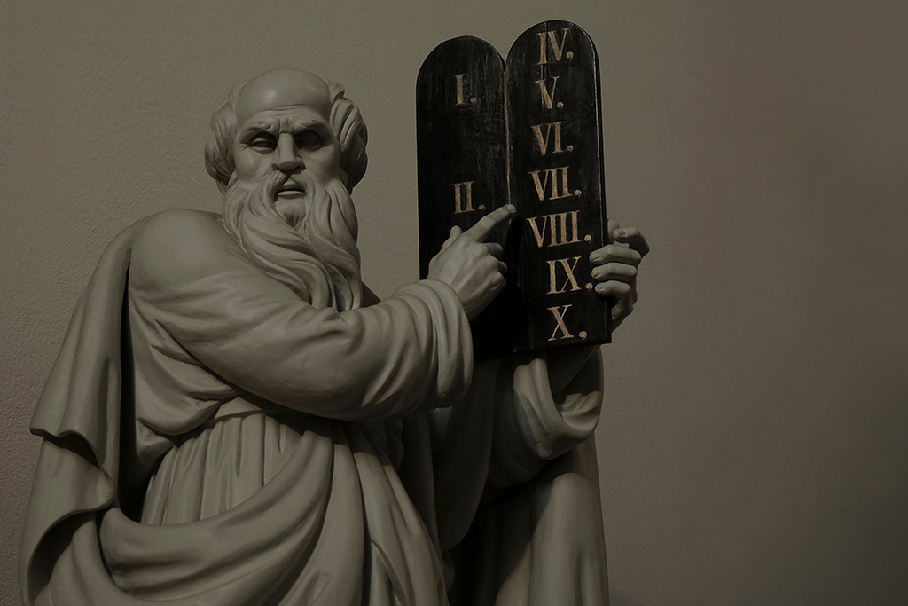 Moses holding the ten commandments tablets