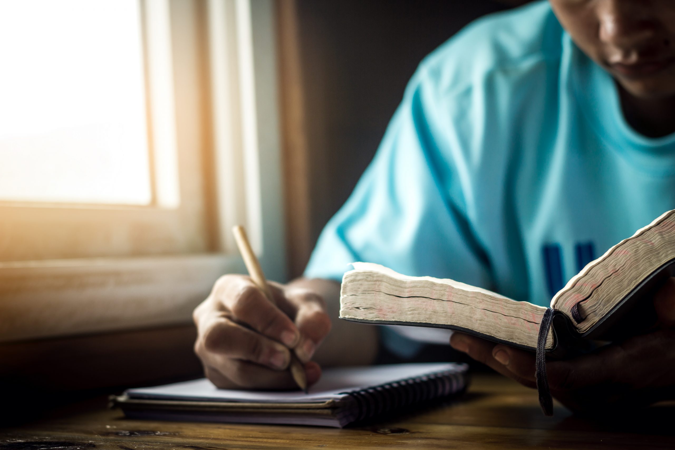 Woman journaling during Bible study
