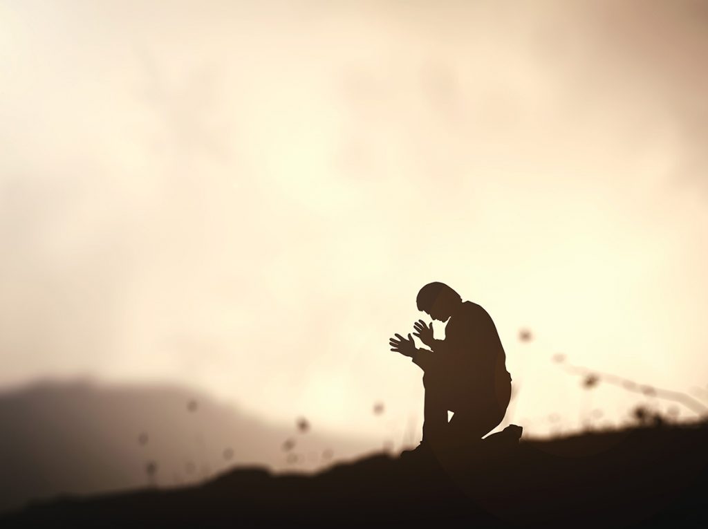Man kneeling down seeking God