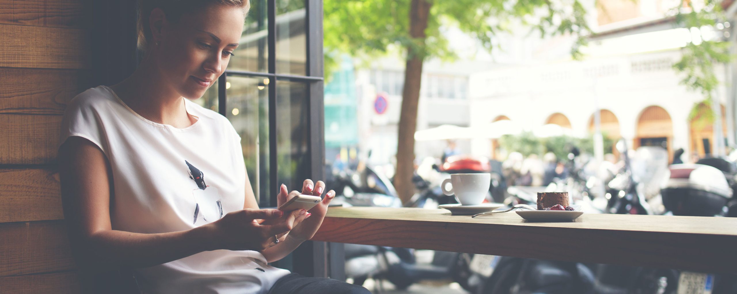 Woman reading the NIV Bible on her phone