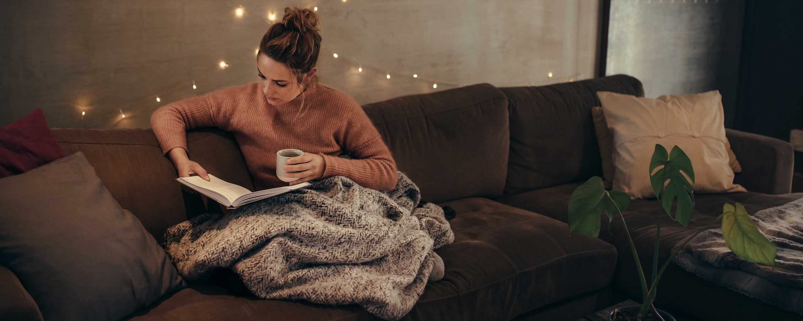 Woman reading one of her NIV Bibles.