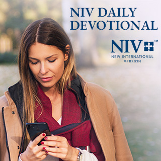 woman reading devotional on her phone