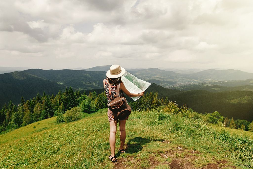 Woman with a map trying to find her way.