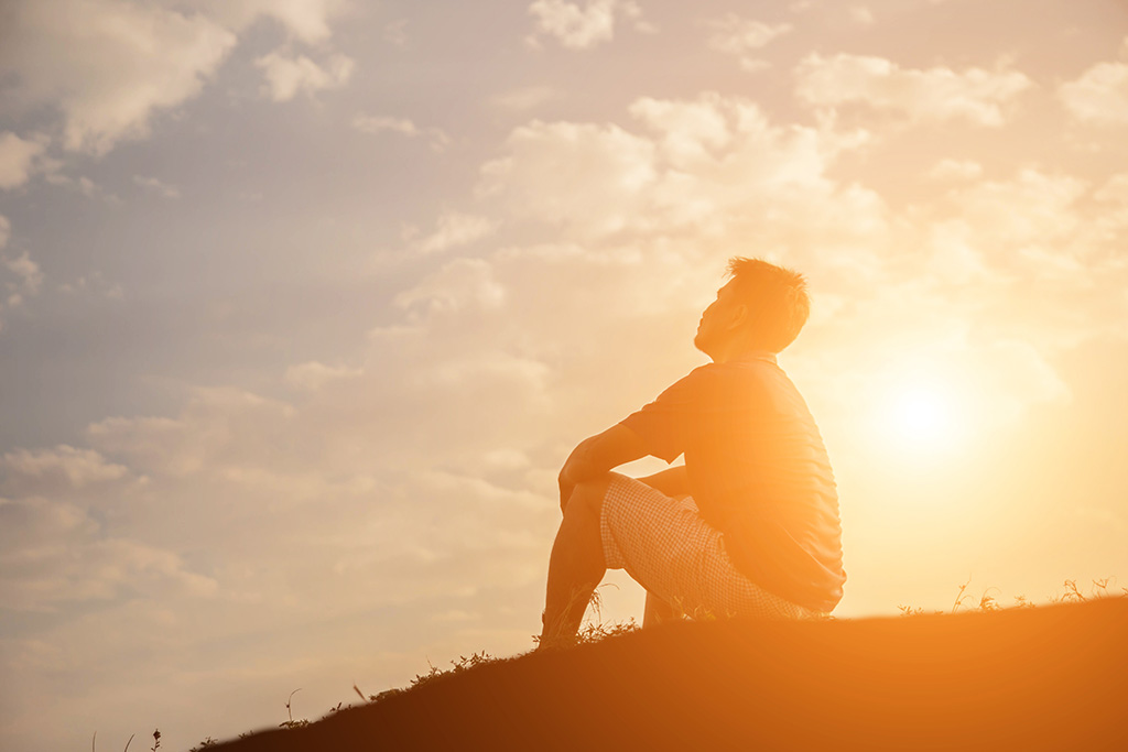 Man out in nature contemplating the promises of God