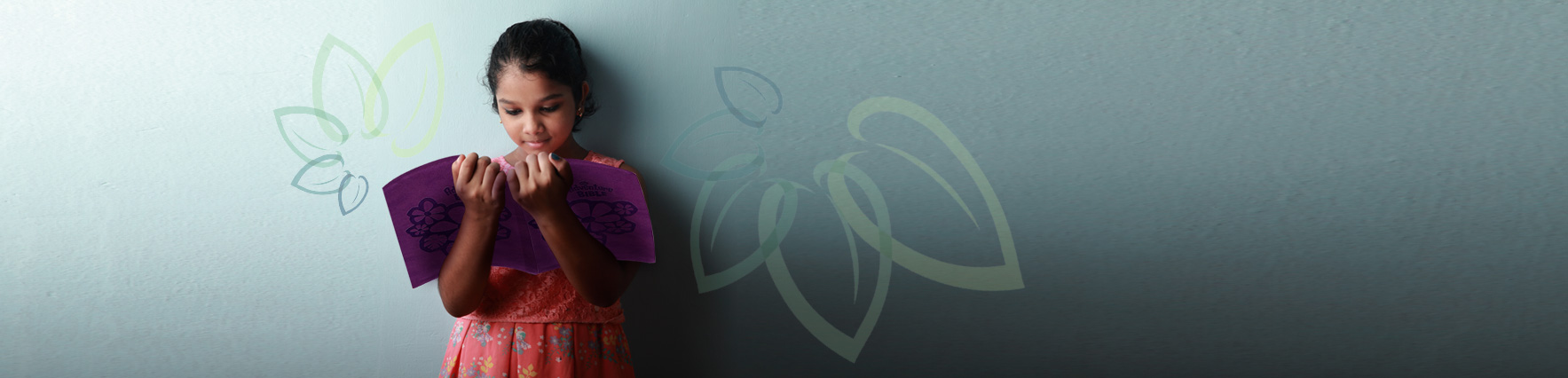 Girl reading an NIrV Bible